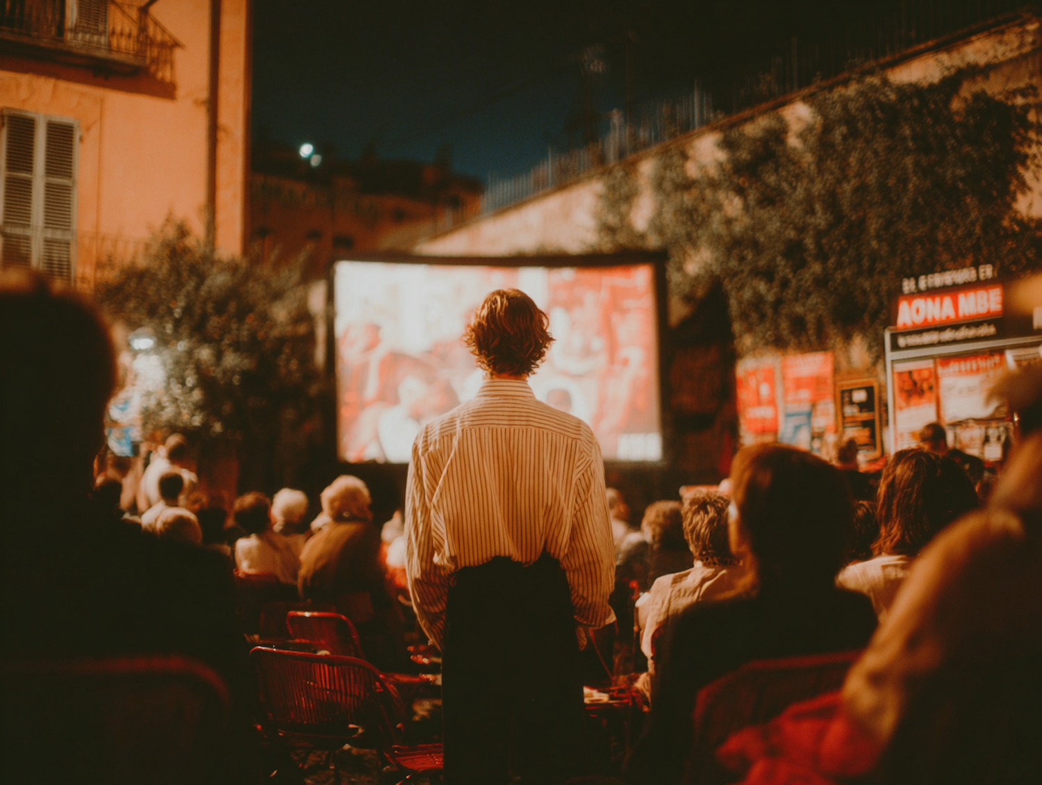 A group of diverse people excitedly gather around a screen, celebrating the success of a crowd-funded sci-fi project, embodying community support.