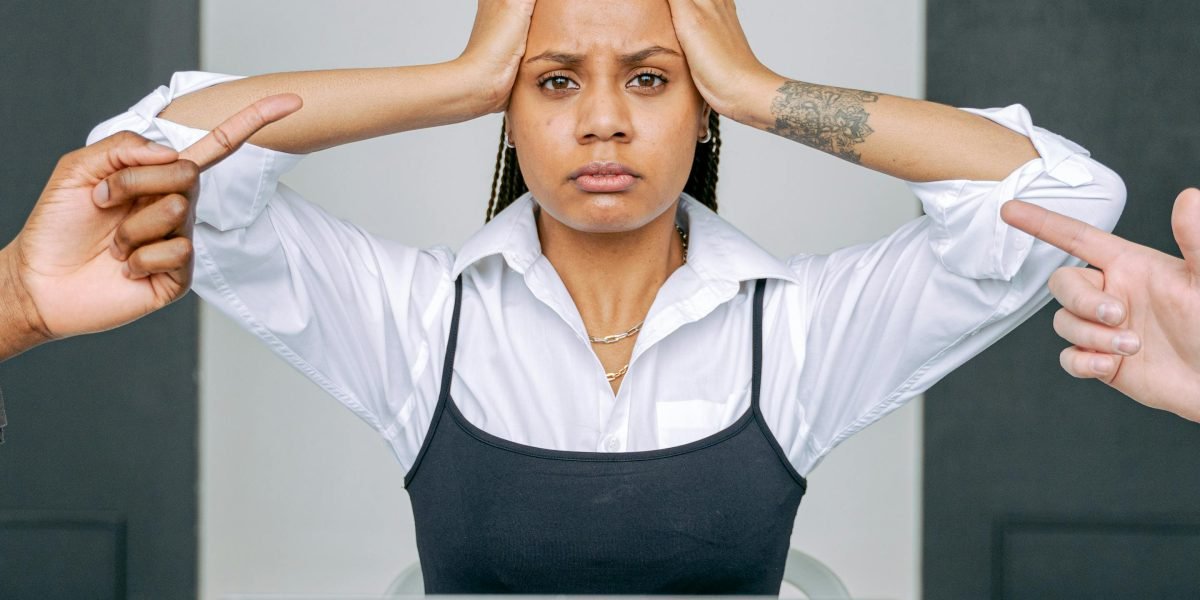 A person contemplating a serious decision, representing an ethical or impossible choice.
