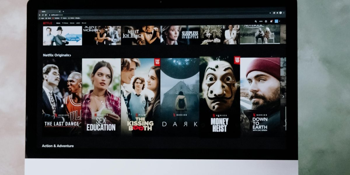 A person contemplating their movie choices, reflecting the challenge of finding content.