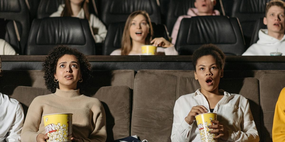 Friends enjoying a film adaptation of a beloved book together.