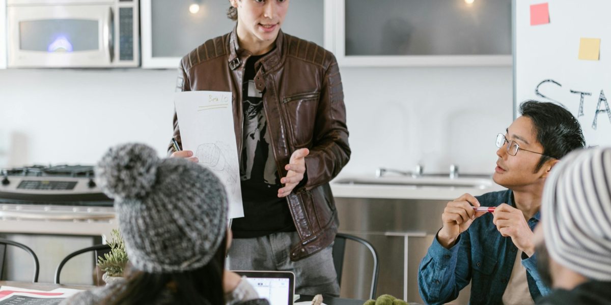 Individuals collaborating and brainstorming, reflecting the conceptual and creative work behind unique storytelling.